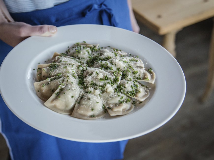Looking for accommodation in Val di Fleres/Pflerschtal? Plate of ravioli topped with parmesan and herbs